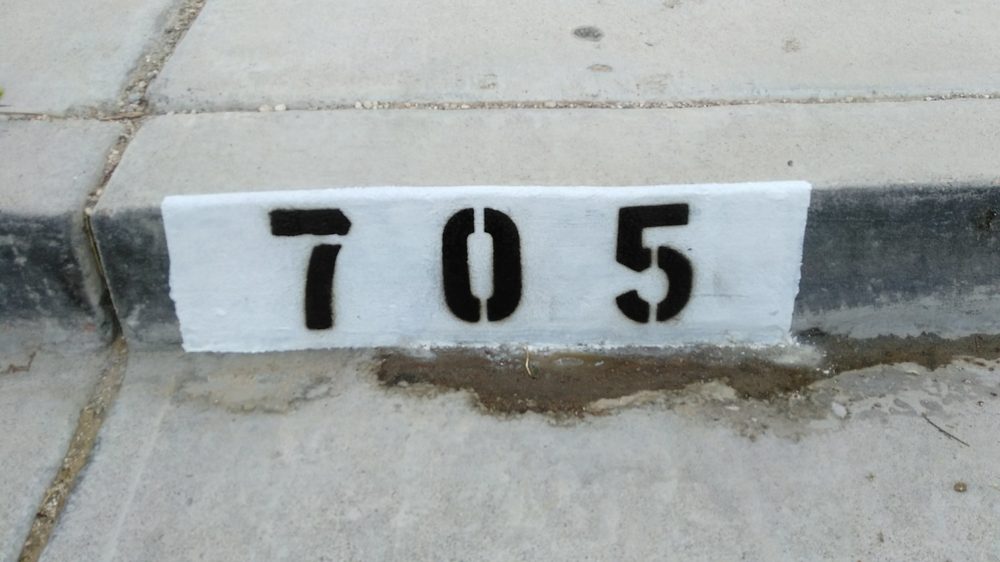 Painted curb numbers 705